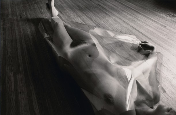 Untitled: Woman Laying On Wood Floor with Plastic Covering