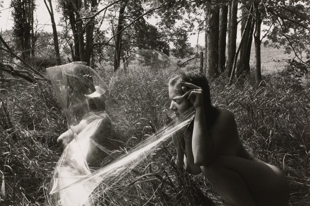 Untitled: Women Looking Through Plastic