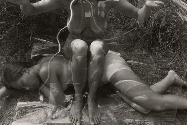 Untitled: Woman Sitting on Woman with Plastic