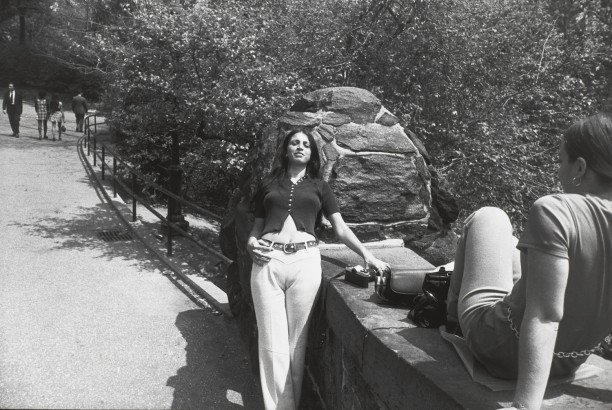 Untitled (Woman leaning against a rock with another facing her on seated on bridge overpass)